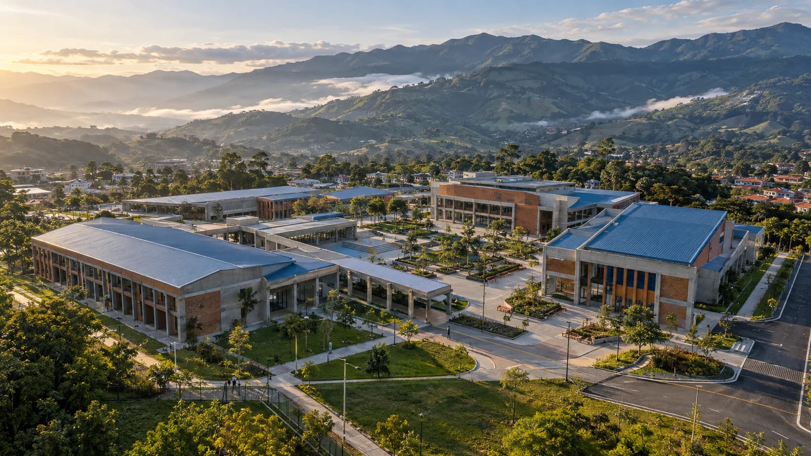 Institutional building complex with metal roofs and green areas set among mountains (illustrative image)