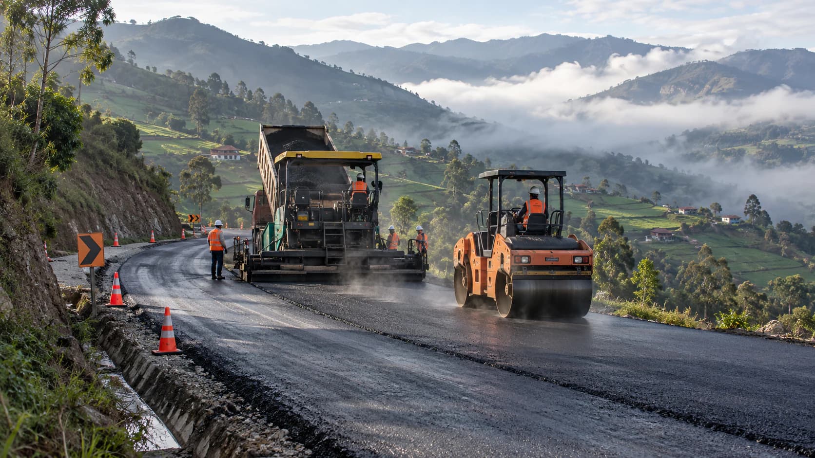 Paver and roller laying fresh asphalt on a mountain highway in the Colombian Andes during road works (illustrative image)